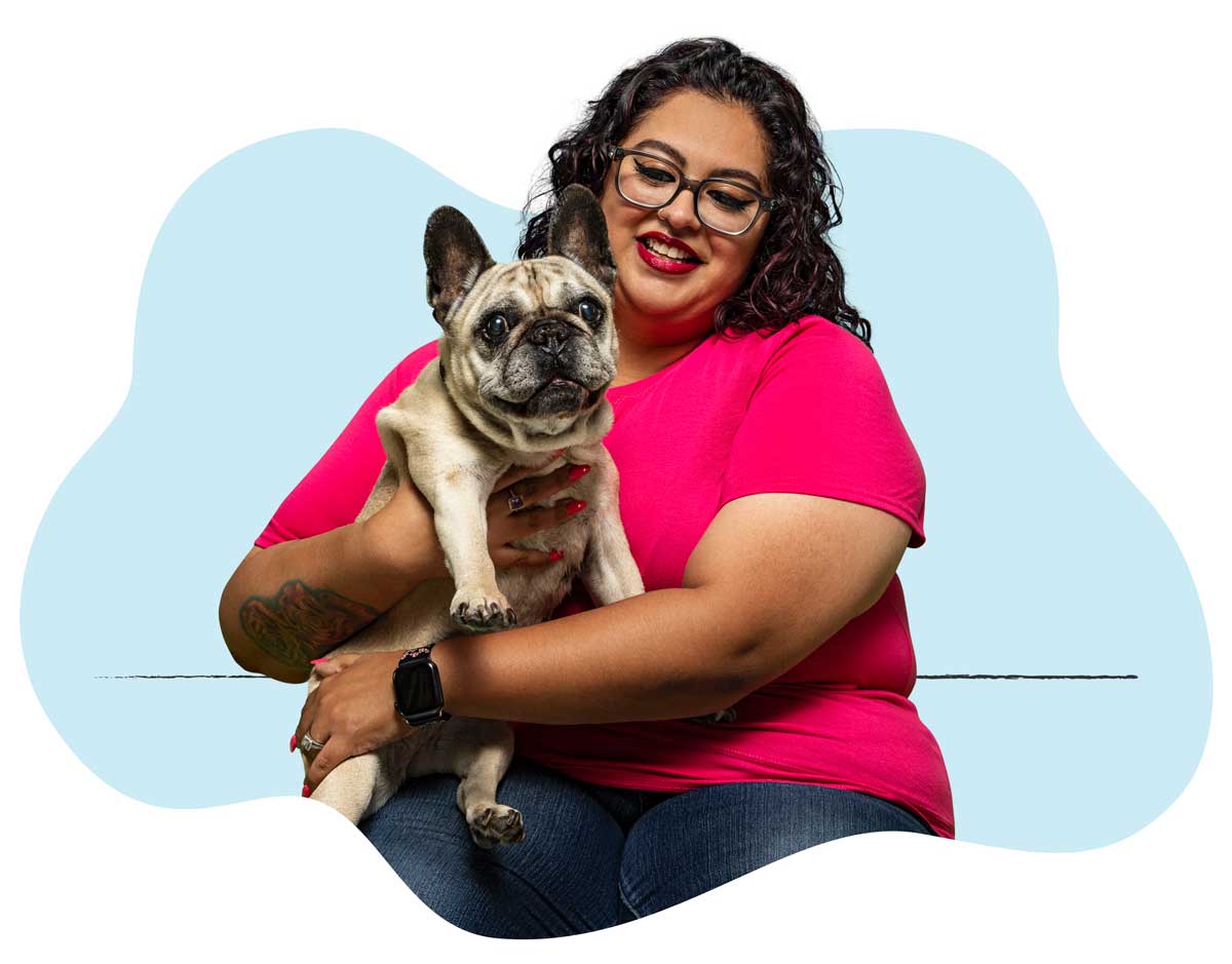 20250423_016B A woman in a neon pink shirt holding her French Bulldog