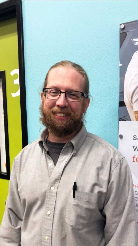 A pet owner inside the Banfield Pet Hospital